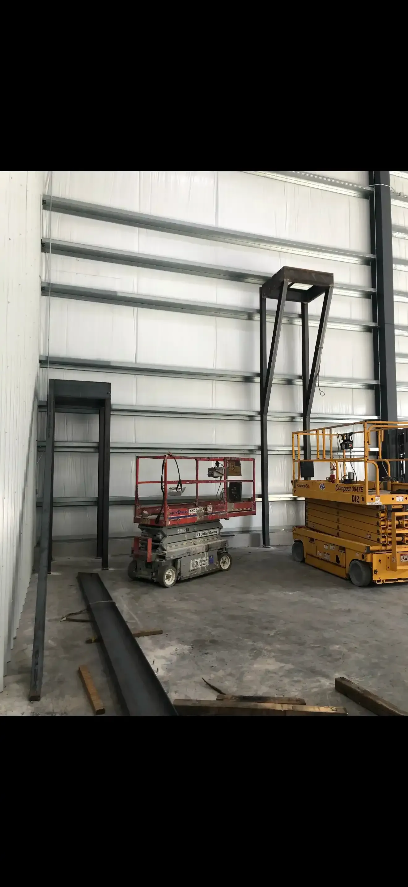 Interior of a warehouse with equipment like a lift, and metal beams in Las Vegas.